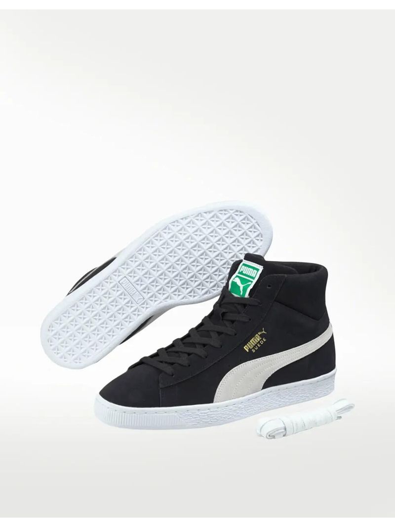 Green and white store high top pumas